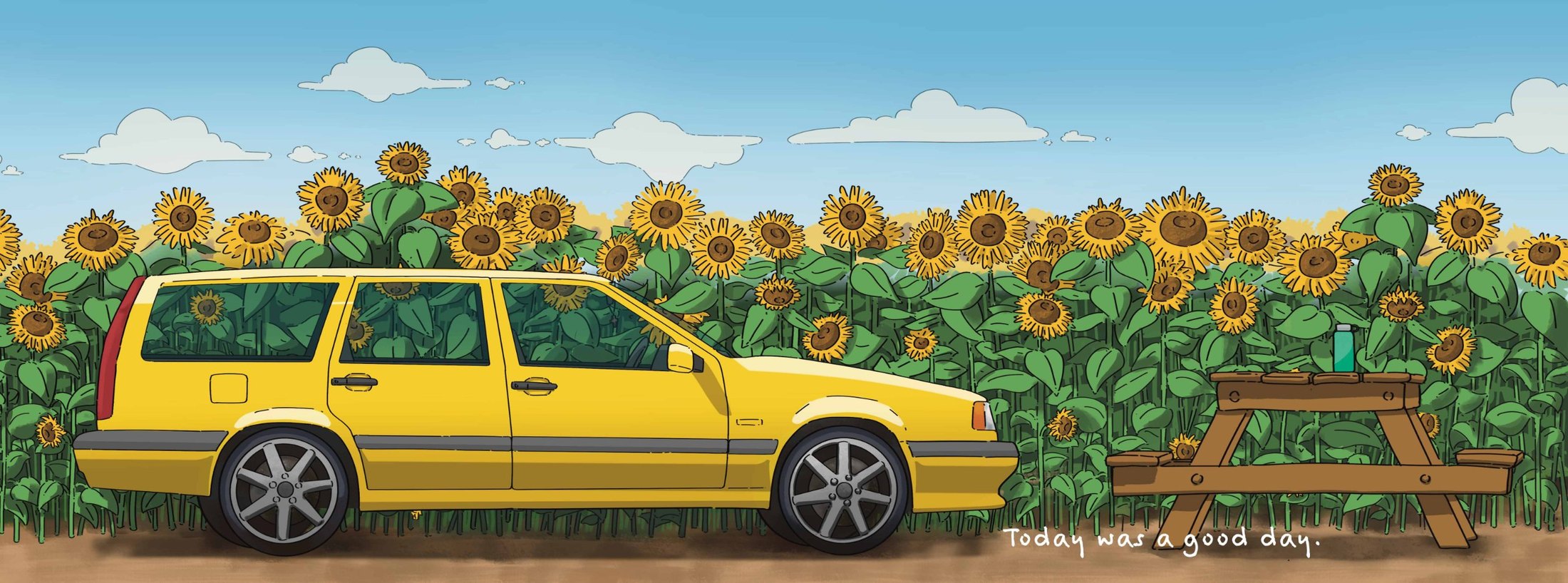 A yellow station wagon parked by a sunflower field and a picnic table
