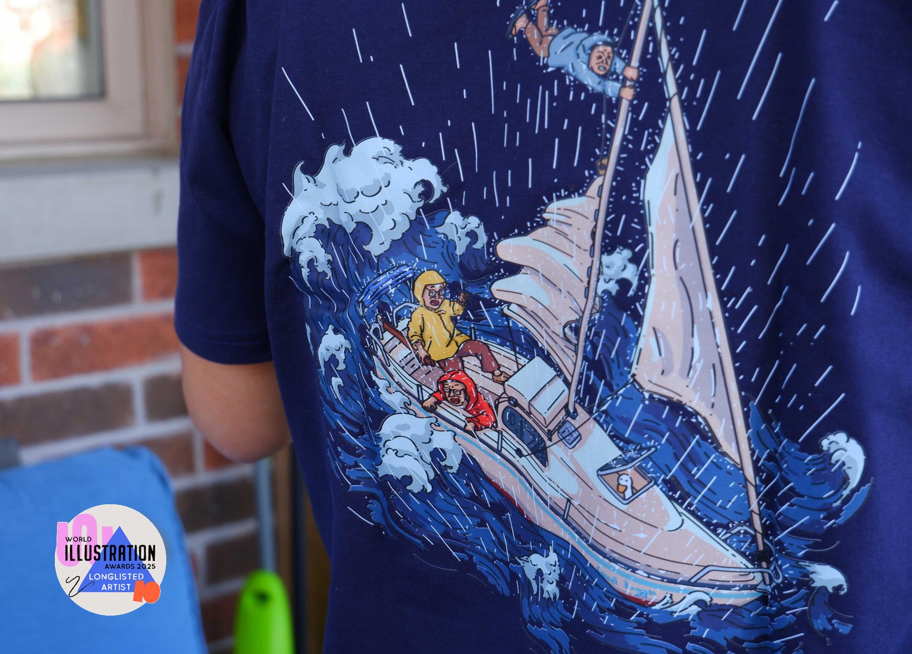 Storm Sailing illustration printed on a navy T-shirt